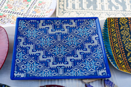 Various ceramic romanian bulgarian and hungarian traditional pottery lined up for sale