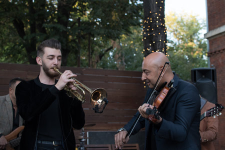 Bucharest, Romania, 21st of September: Mahala Rai Banda music band formation well known in Romania for gypsy music, traditional instrumental authentic sounds during live music concertのeditorial素材
