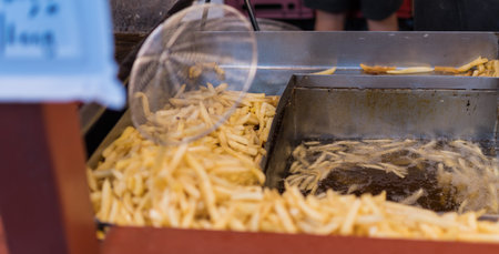 Deep fried fast food potatoes fries, during fast food festival