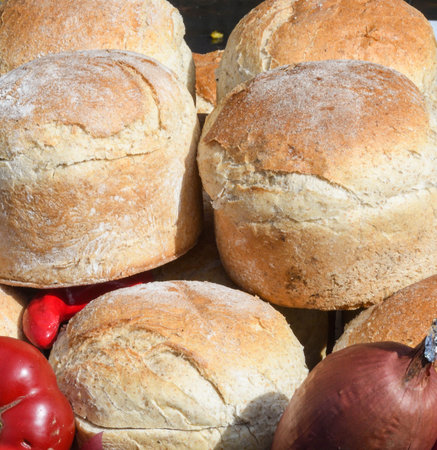 Homemade traditional buns of bread, authentic rustic recipe on counter top during food festival,...