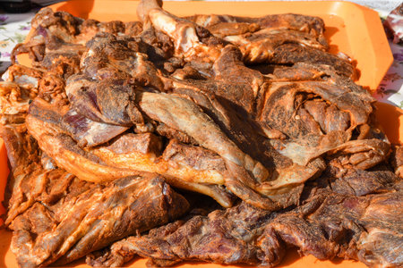 Assorted meat products, sausages, chorizo, spices on a dark table. View from above. Large selection of different dried spicy seasoned beef and pork sausages. Street food, fast food assortment of meatの写真素材