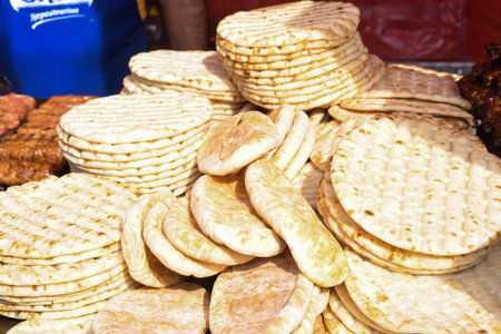 Pile of fresh pita flat bread. Gluten free lebanese or greek specialty. Grilled or oven baked. Food...