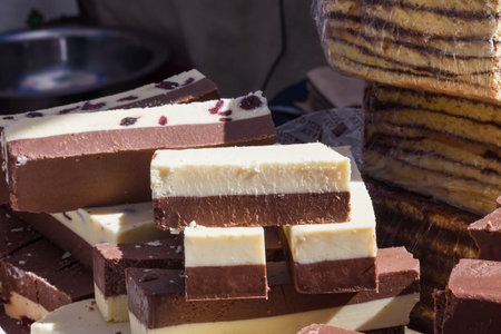 Display window of a bakery and pastry shop of with variety of baked goods, breads, donuts and puff pastry during street food festivalの写真素材