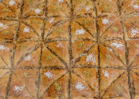 Traditional baklava sweet dessert delights, cataif pastry during hotel brunch buffet outside outdoor in the garden by the pool. Fresh Food Buffet Brunch Catering Dining Eating Party Sharing Conceptの写真素材