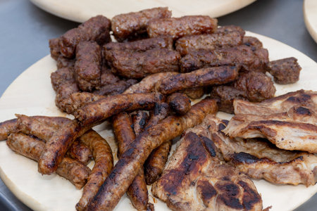 Fresh grilled meat sausage pork chicken minced meat mici during hotel brunch buffet outside outdoor...
