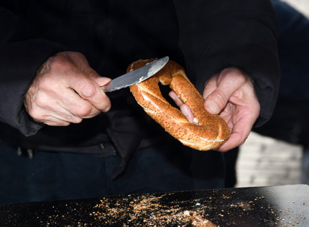 Simit is a Turkish loop-shaped bread, encrusted with sesame seeds, and you can find it encrusted...