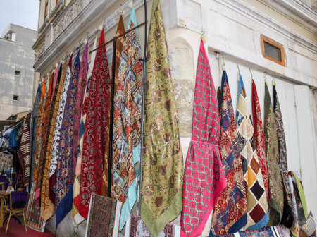 Rows of colourful silk scarfs hanging at a market stall in Istanbul, Turkey