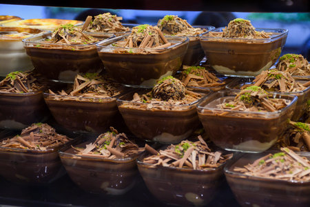 Chocolate mousse pudding in portion glasses on stack one over another, for sale in Turkish dessert...