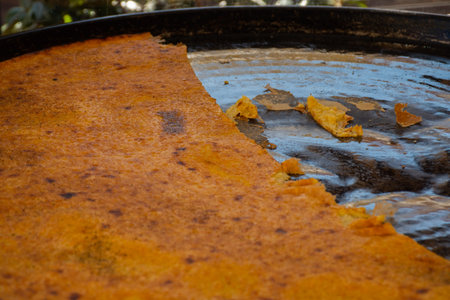 Big Plate of Farinata or Cecina or Torta di ceci thin unleavened pancake or crepe of chickpea flour...