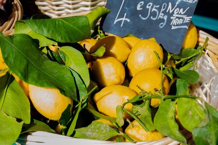 Fresh yellow lemons. Lots of fresh lemons fruits sale in supermarket. Many fresh lemons wallpaper.の写真素材