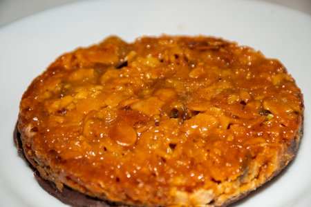 French crunchy almond tart with caramel and apples