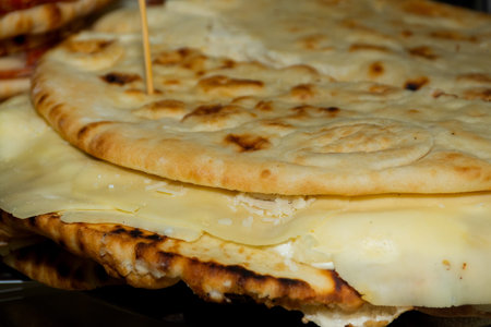 Pita with ham, cheese and salami display at the market. Italian street foodの写真素材