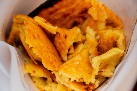 Big Plate of Farinata or Cecina or Torta di ceci thin unleavened pancake or crepe of chickpea flour...