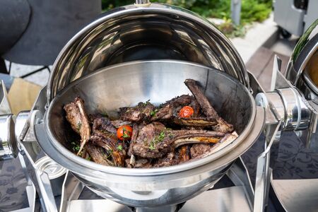 Live food stations. Kitchenware in the line catering summer brunch buffet food luxury hotel outdoor outside garden by the pool al fresco restaurant.Corporate cocktail event party warm food stations.の写真素材