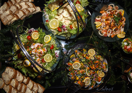 Marinated shrimp cocktail, mussels, salad vegetables during hotel brunch buffet outside outdoor in...