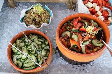 Luxury catering by the pool, food bloggers event, banquet, wedding, festive, hotel brunch buffet arrangement with clean simple design, decorations, boat filled with ice. Modern design and decorationsの写真素材