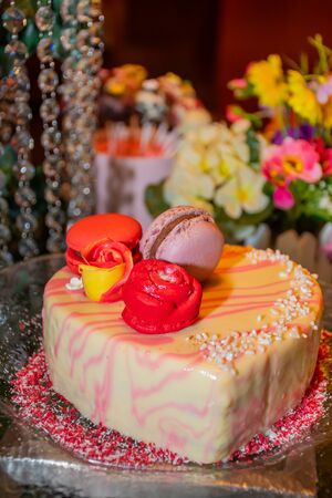 Festive brunch buffet celebration for special occasions like Valentine's Day, Mother's Day, Woman's Day, catering and candy bar self service events. Mousse, cupcakes, pop cakes and macaroons displayの写真素材