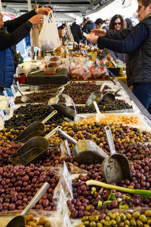 Nice, France, 25th of February 2020: Large range of olives for sale at an open air market in the South of Franceのeditorial素材