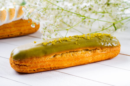 Eclairs pastry made with choux dough filled with cream and topping. Elegant, luxurious, expensive...