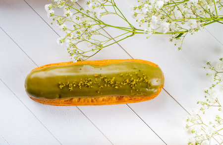 Eclairs pastry made with choux dough filled with cream and topping. Elegant, luxurious, expensive...