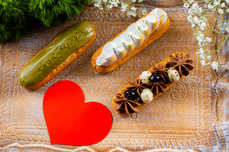 Eclairs pastry made with choux dough filled with cream and topping. Elegant, luxurious, expensive...
