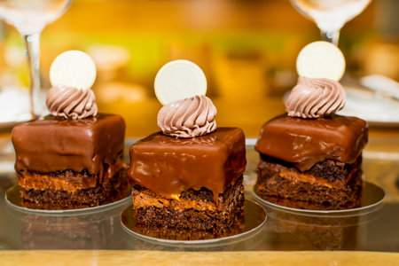 Selection of desserts: amandine, meringue with chocolate and strawberries, caramel cake, in a...