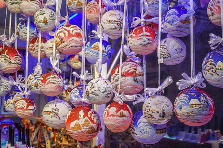 Christmas decorations on the market in Vienna. For sale on Christmas fair in Western Europe, Vienna, Austria. Golden balls, bulbs, bubbles, decorations and ornaments, colored shiny magic fairy taleの写真素材
