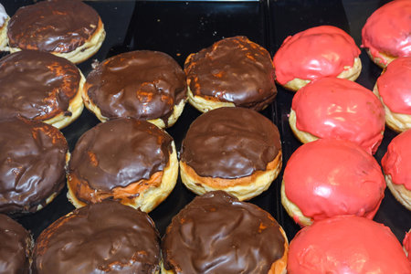 Display of traditional doughnuts on sale at Christmas market stall in Austria (translation: Old...