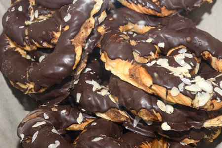 Bavarian authentic pretzels for Oktoberfest or Autumn Fest, Christmas or festive celebration. German or Austrian salted or with seeds brezel bread ideal for morning snack, cut in half with ham, cheeseの写真素材