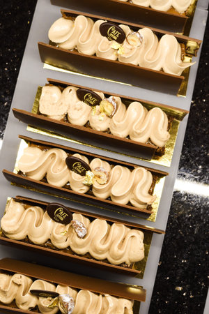 Various types of cakes, tart, mousse, pies for sale in bakery or pastry shop, gourmet luxury concept...