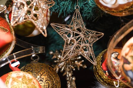 Christmas decorations and ornaments on the market in Vienna. For sale on Christmas fair in Western Europe, Vienna, Austria. Colored xmas globes, balls, bulbs and feathers details, fairy-tale sceneの写真素材