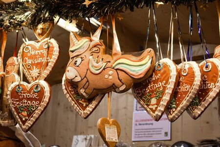 Many gingerbread cookies over the counter, during Vienna Christmas Market. Heart, snow flake, unicorn shape sweet dessert for sale,festival winter celebration. Merry Christmas candy bar buffet conceptの写真素材
