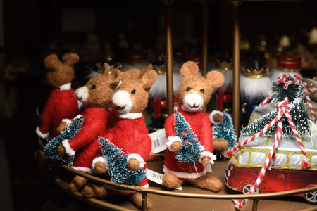 Decoration mouse toy holding a Christmas tree, cute funny ornament for festive season. Christmas...