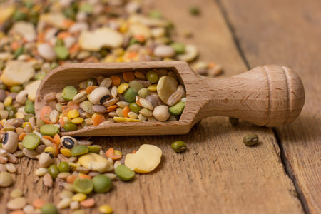 Mix from grain  on a wooden background.
