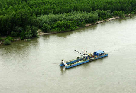 Barge along the Danube River seen from helicopterの写真素材