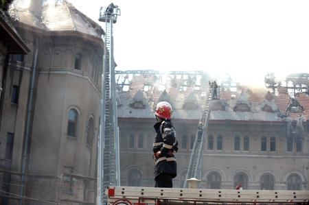 Firefighters douse a fire in an old building