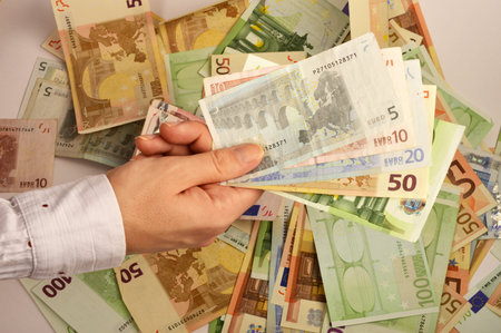 Holding different of euro banknotes