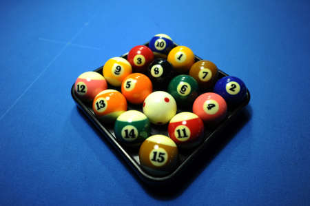 Billiard balls on a blue tableの写真素材
