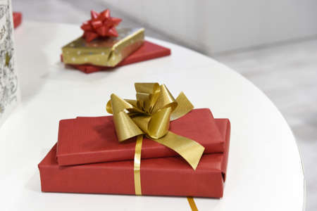 Wrapped presents in red paperの写真素材