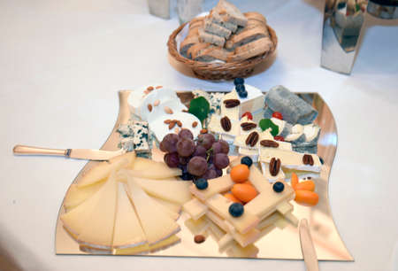 Cheese specialties served on a porcelain plateの写真素材