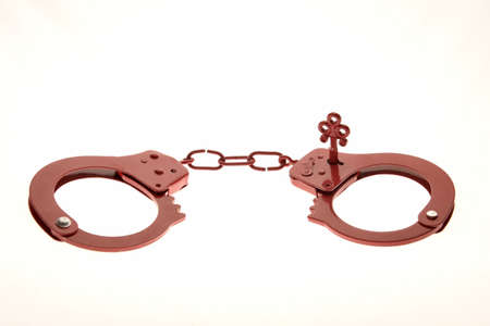 Red handcuffs as a sex toyの写真素材