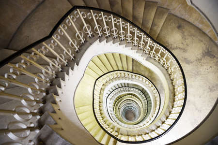 Spiral staircase in the interior of a tall buildingの写真素材
