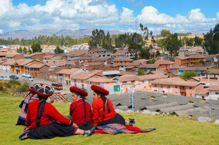 CHINCHERO, PERU- JUNE 3, 2013: Native Cusquena women dressed in traditional colorful clothingのeditorial素材