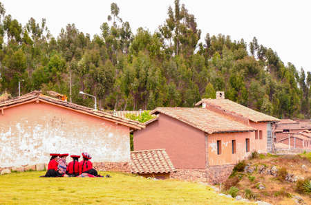 CHINCHERO, PERU- JUNE 3, 2013: Native Cusquena women dressed in traditional colorful clothingのeditorial素材