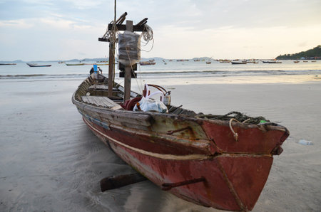 NGAPALI, MYANMAR- SEPTEMBER 27, 2016: Fisherman's boat fallen into ruin and disrepair on a beachのeditorial素材