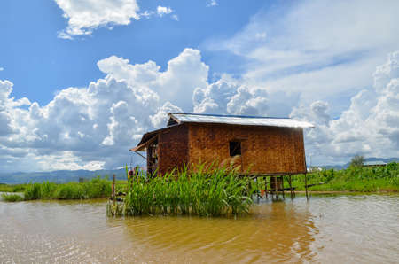INLE LAKE, MYANMAR- SEPTEMBER 26, 2016: Traditional wooden houses on piles inhabited by Inthar tribeのeditorial素材