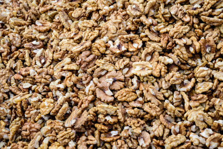 Large group of fresh walnut kernels sold at a spice food market, organic food background