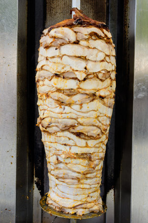 Grilled skewered chicken on spit, a traditional meat that will be shaved for traditional Turkish...