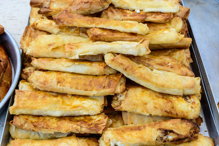 Traditional Turkish fried feta rolls called Sigara Boregi or borek, made of cheese, ready to eat and...
