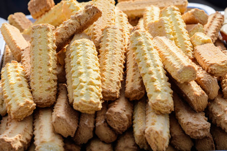 Fresh home backed crispy crackers in direct sun light, displayed for sale at a bakery at a street...